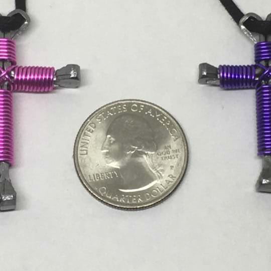 pink and purple nail crosses Necklace side by side
