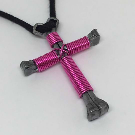 large nail cross necklace in pink made with horseshoe nails